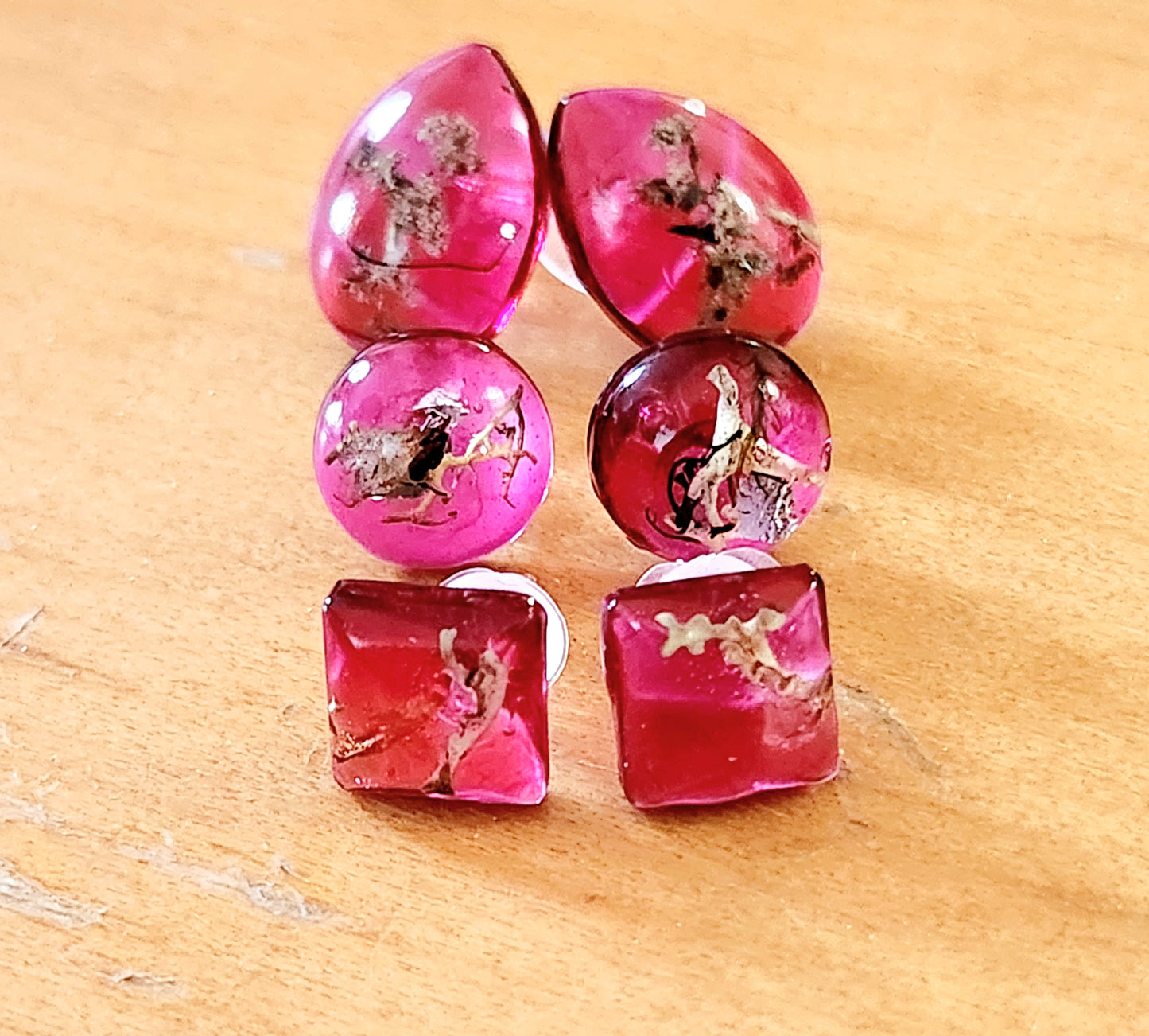 Small red earrings with real plants