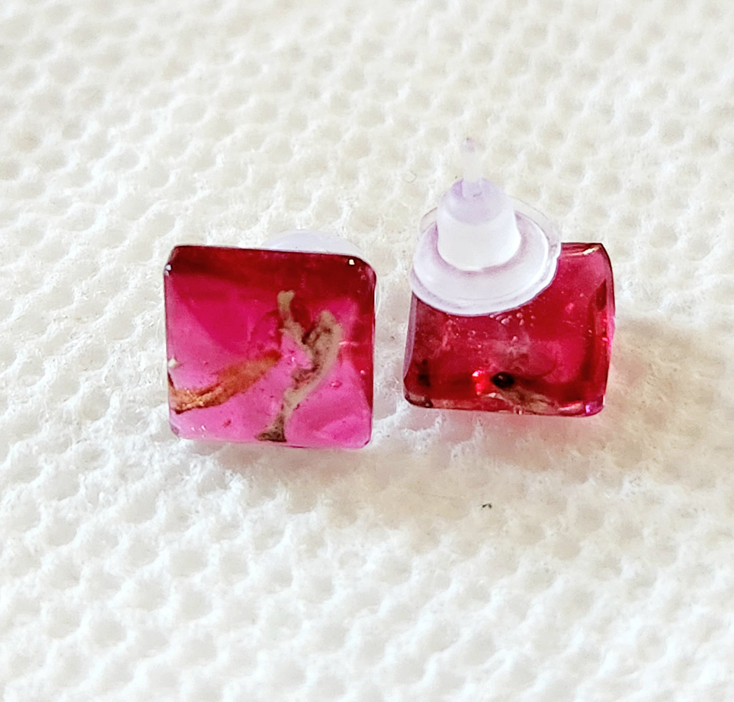 Small red earrings with real plants