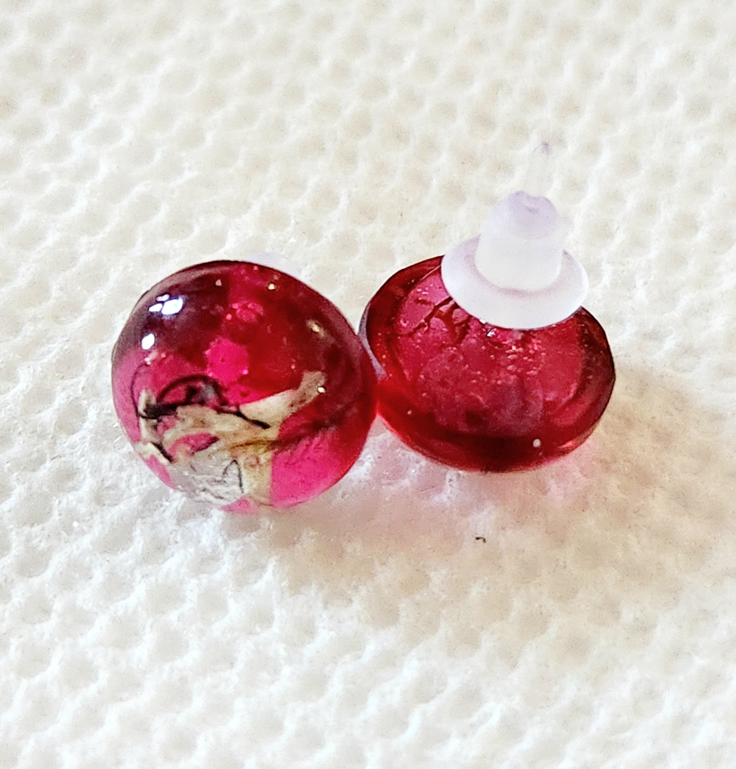 Small red earrings with real plants