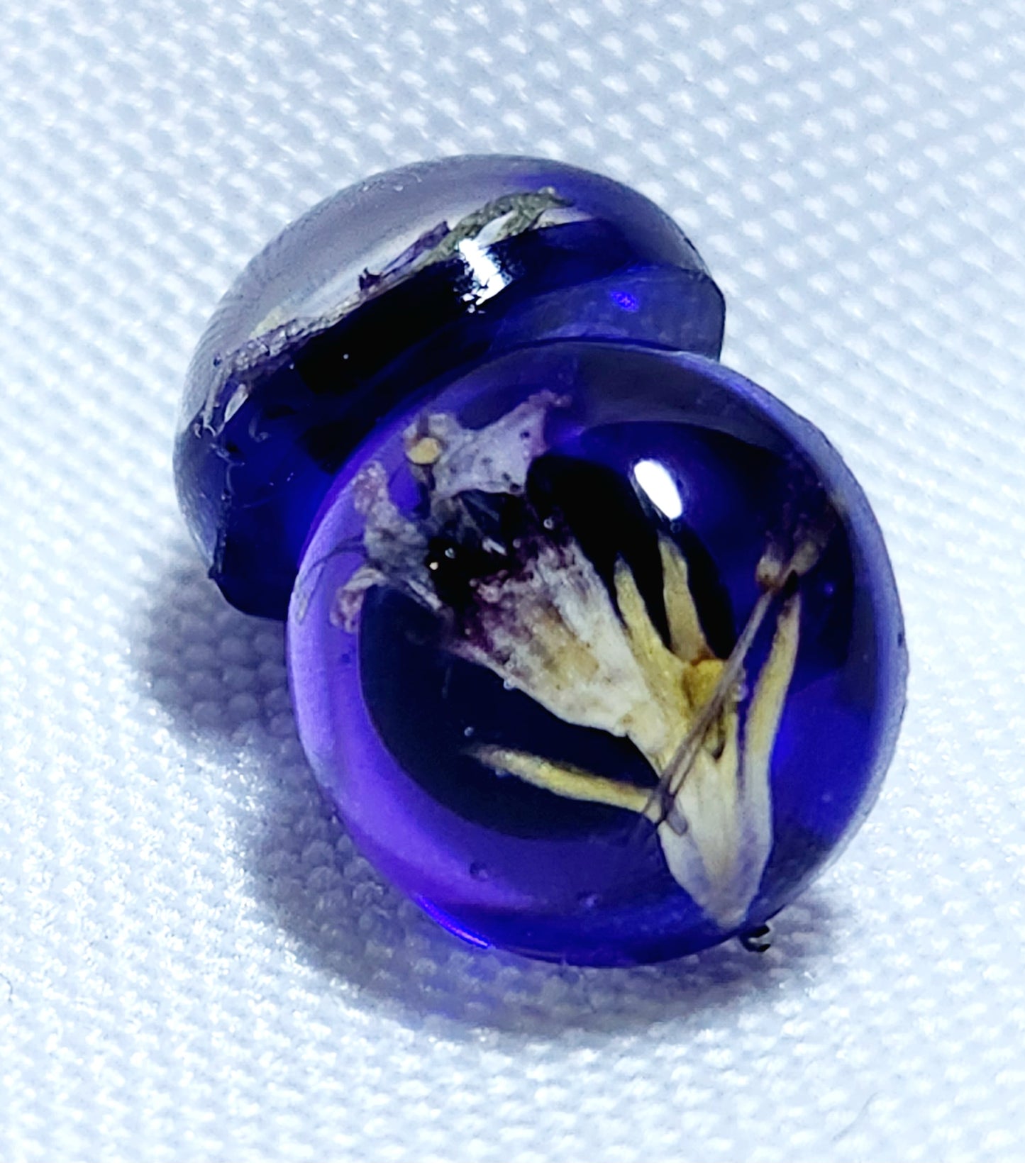 Purple earrings with tundra flowers