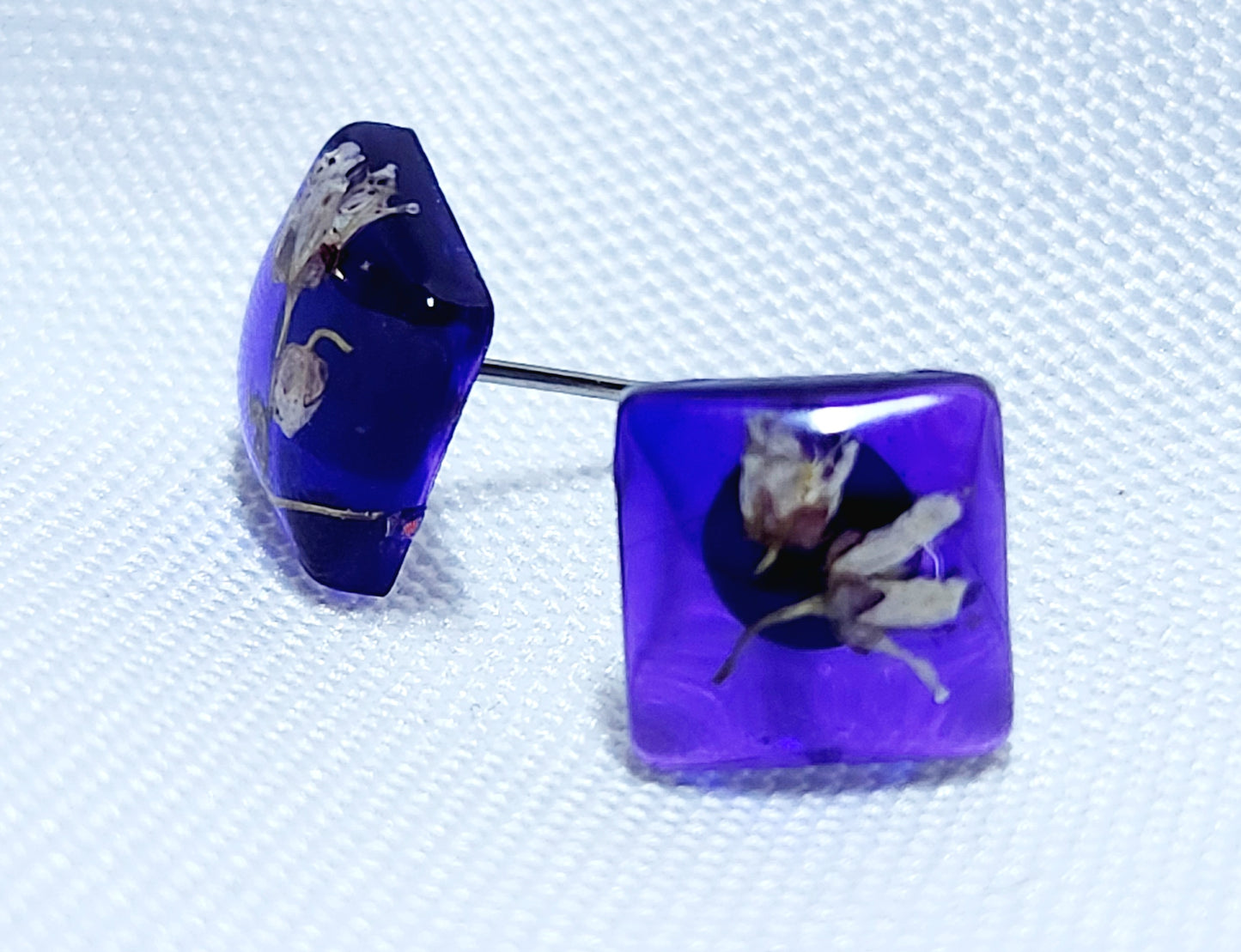 Purple earrings with tundra flowers
