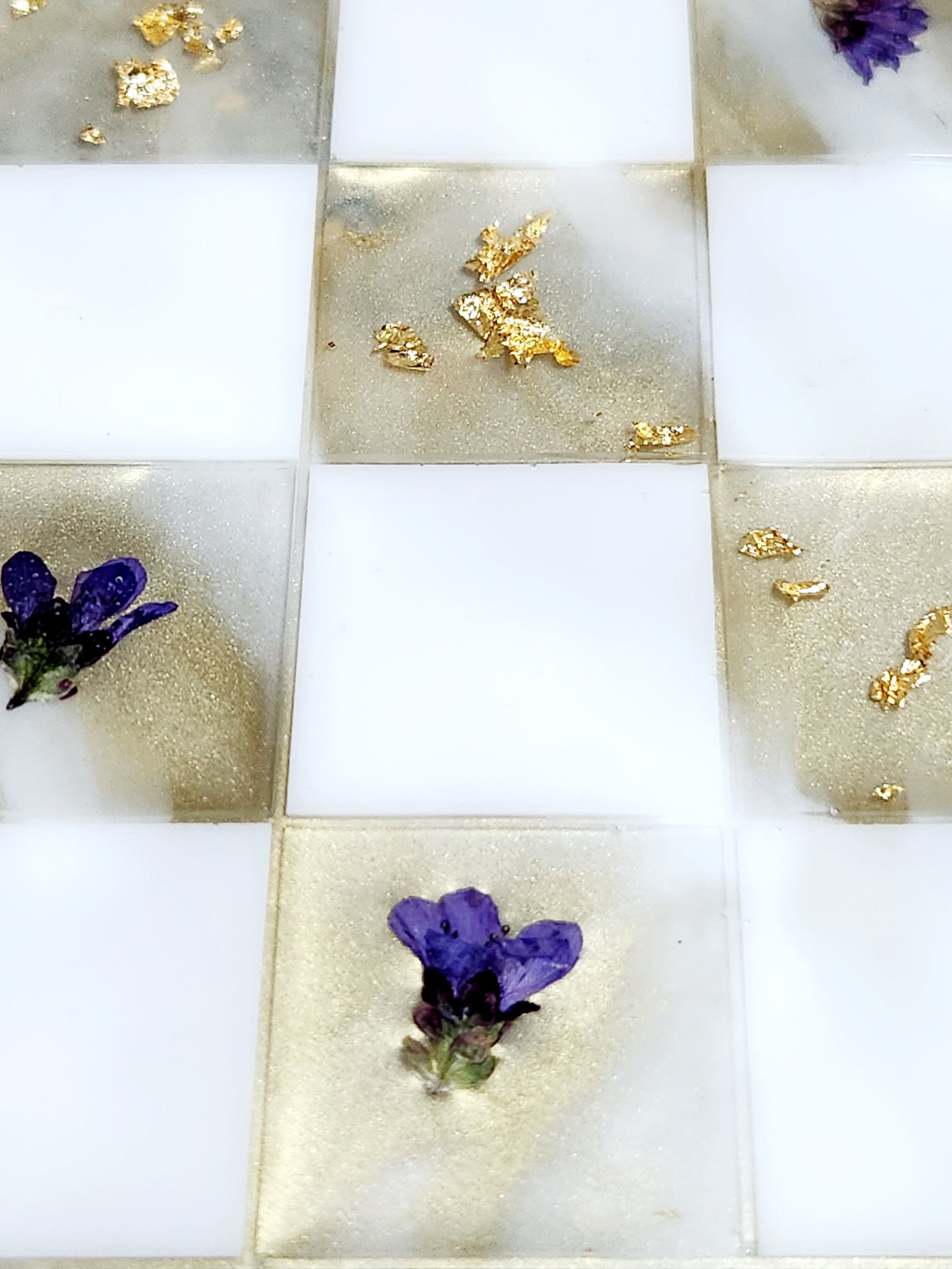 Chess set - board and pieces, purple saxifrage and gold foil.